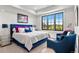 Bright bedroom with large window and blue accents at 8625 Eagle Moon Way, Parker, CO 80134