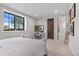 Bright bedroom with large window, desk, and ensuite bathroom at 8625 Eagle Moon Way, Parker, CO 80134