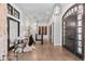 Bright foyer with hardwood floors, stylish lighting, and a modern design at 8625 Eagle Moon Way, Parker, CO 80134