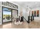 Bright foyer with hardwood floors, modern lighting, and access to the patio at 8625 Eagle Moon Way, Parker, CO 80134