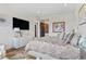Spacious main bedroom featuring plush bedding, soft lighting, and elegant decor at 8625 Eagle Moon Way, Parker, CO 80134