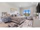 Large, bright bedroom with a window and sitting area offers a luxurious personal retreat at 8625 Eagle Moon Way, Parker, CO 80134