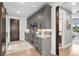 Hallway with gray cabinets and drawers provides ample storage near the door to the house at 8625 Eagle Moon Way, Parker, CO 80134