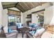 Covered outdoor living space with a full kitchen and comfortable seating at 8625 Eagle Moon Way, Parker, CO 80134
