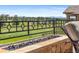 Outdoor patio with stone fire feature and expansive views of the surrounding landscape at 8625 Eagle Moon Way, Parker, CO 80134