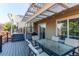 Outdoor living space featuring a pergola-covered deck and dining area at 4483 S Fundy St, Centennial, CO 80015