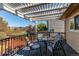 Inviting back deck with pergola, outdoor seating, and views of the fenced backyard at 4483 S Fundy St, Centennial, CO 80015