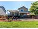 Spacious backyard with tiered deck and patio seating areas at 4483 S Fundy St, Centennial, CO 80015