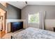 Spacious bedroom featuring vaulted ceilings, white trim, and a large window with natural light at 4483 S Fundy St, Centennial, CO 80015