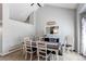 Bright dining room featuring tall ceilings, modern decor, and neutral walls at 4483 S Fundy St, Centennial, CO 80015