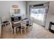 Charming dining room features a modern table set with white chairs and updated décor at 4483 S Fundy St, Centennial, CO 80015
