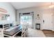 Inviting dining room features a dark wood table, white chairs, and a view to the front yard at 4483 S Fundy St, Centennial, CO 80015