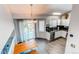 Bright kitchen features modern appliances, updated cabinets, and a stylish dining area at 4483 S Fundy St, Centennial, CO 80015