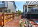 Fenced-in side yard with a gravel pathway and rock features at 4483 S Fundy St, Centennial, CO 80015