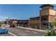 Exterior street-level view of a modern strip mall with multiple storefronts and ample parking at 4483 S Fundy St, Centennial, CO 80015