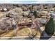 Aerial view of the brick home and neighborhood in a suburban community at 2576 Krameria St, Denver, CO 80207