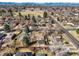 Aerial view of the brick home with the backyard, patio and the city skyline in the background at 2576 Krameria St, Denver, CO 80207