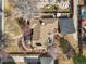 An aerial view showcases a charming home with a pergola, patio, and landscaped surroundings at 2576 Krameria St, Denver, CO 80207