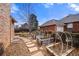 Backyard featuring garden beds with overhead hoops and a flagstone walkway at 2576 Krameria St, Denver, CO 80207