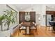 Elegant dining area featuring a wooden table and hardwood floors, perfect for Gathering gatherings and entertaining at 2576 Krameria St, Denver, CO 80207