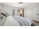 Main bedroom with an exit to the backyard, featuring hardwood floors and double closets at 2576 Krameria St, Denver, CO 80207