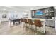Finished basement bar area features ample seating, TV, and stylish design elements perfect for entertaining at 25548 E Fair Dr, Aurora, CO 80016