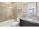 Well-lit bathroom features a shower over tub and granite countertop vanity, offering a functional and stylish space at 25548 E Fair Dr, Aurora, CO 80016