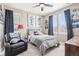 Cozy bedroom with abundant natural light, featuring sporty decor, a ceiling fan and inviting furnishings at 25548 E Fair Dr, Aurora, CO 80016