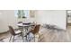 Stylish dining area featuring a modern round table, comfortable seating and a chic decorative rug at 25548 E Fair Dr, Aurora, CO 80016