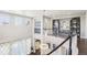 Open foyer with a curved staircase, decorative lighting, and elegant decor enhances the home's welcoming ambiance at 25548 E Fair Dr, Aurora, CO 80016