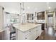 Spacious kitchen with large island featuring bar seating and granite countertop at 25548 E Fair Dr, Aurora, CO 80016