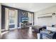 Modern living room with dark hardwood floors, stylish decor, and ample natural light at 25548 E Fair Dr, Aurora, CO 80016