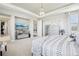 Spacious main bedroom features elegant decor, large windows, and tray ceiling for a relaxing atmosphere at 25548 E Fair Dr, Aurora, CO 80016