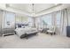 Serene main bedroom with large windows, soft lighting, and tray ceiling offers a peaceful retreat at 25548 E Fair Dr, Aurora, CO 80016