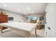 Basement features and open layout, table covered with cloth, and a view of a comfortable seating area at 1455 Flowers Ct, Erie, CO 80516