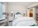 Bright bedroom featuring a comfortable bed, natural light, and neutral decor at 1455 Flowers Ct, Erie, CO 80516