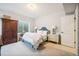 Cozy bedroom featuring a comfortable bed, ample natural light, and neutral decor at 1455 Flowers Ct, Erie, CO 80516