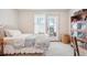 Serene bedroom with a balcony, a bookshelf, and soft natural light at 1455 Flowers Ct, Erie, CO 80516