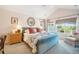 Inviting main bedroom with a vaulted ceiling, cozy seating, and plenty of natural light creating a relaxing retreat at 1455 Flowers Ct, Erie, CO 80516