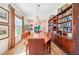 Elegant dining room with large wooden table and upholstered chairs at 1455 Flowers Ct, Erie, CO 80516