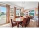 Cozy dining room features a wooden table, upholstered chairs, and natural light at 1455 Flowers Ct, Erie, CO 80516