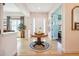 Welcoming foyer with hardwood floors, a round table, and stylish decor at 1455 Flowers Ct, Erie, CO 80516