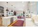 Bright, open kitchen with a large island, pendant lighting, and stainless steel appliances at 1455 Flowers Ct, Erie, CO 80516