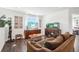 Comfortable living room area featuring natural light, and an aquarium at 1455 Flowers Ct, Erie, CO 80516