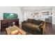 Cozy living room with a comfortable sofa, aquarium, and hardwood floors, perfect for relaxing or entertaining at 1455 Flowers Ct, Erie, CO 80516