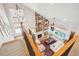 Aerial view of an open living room with custom bookcase and fireplace at 1455 Flowers Ct, Erie, CO 80516