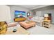 Relaxing living room area that includes a modern television and comfortable chairs at 1455 Flowers Ct, Erie, CO 80516