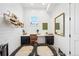 Bright office with a large desk, decorative hats, and dual dog beds at 1455 Flowers Ct, Erie, CO 80516
