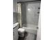 Bright bathroom featuring a shower with white marble surround, floral shower curtain, and granite-topped vanity at 9440 E Girard Ave # 1, Denver, CO 80231