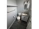 Clean bathroom featuring modern fixtures, granite countertop, and gray wood-look flooring at 9440 E Girard Ave # 1, Denver, CO 80231